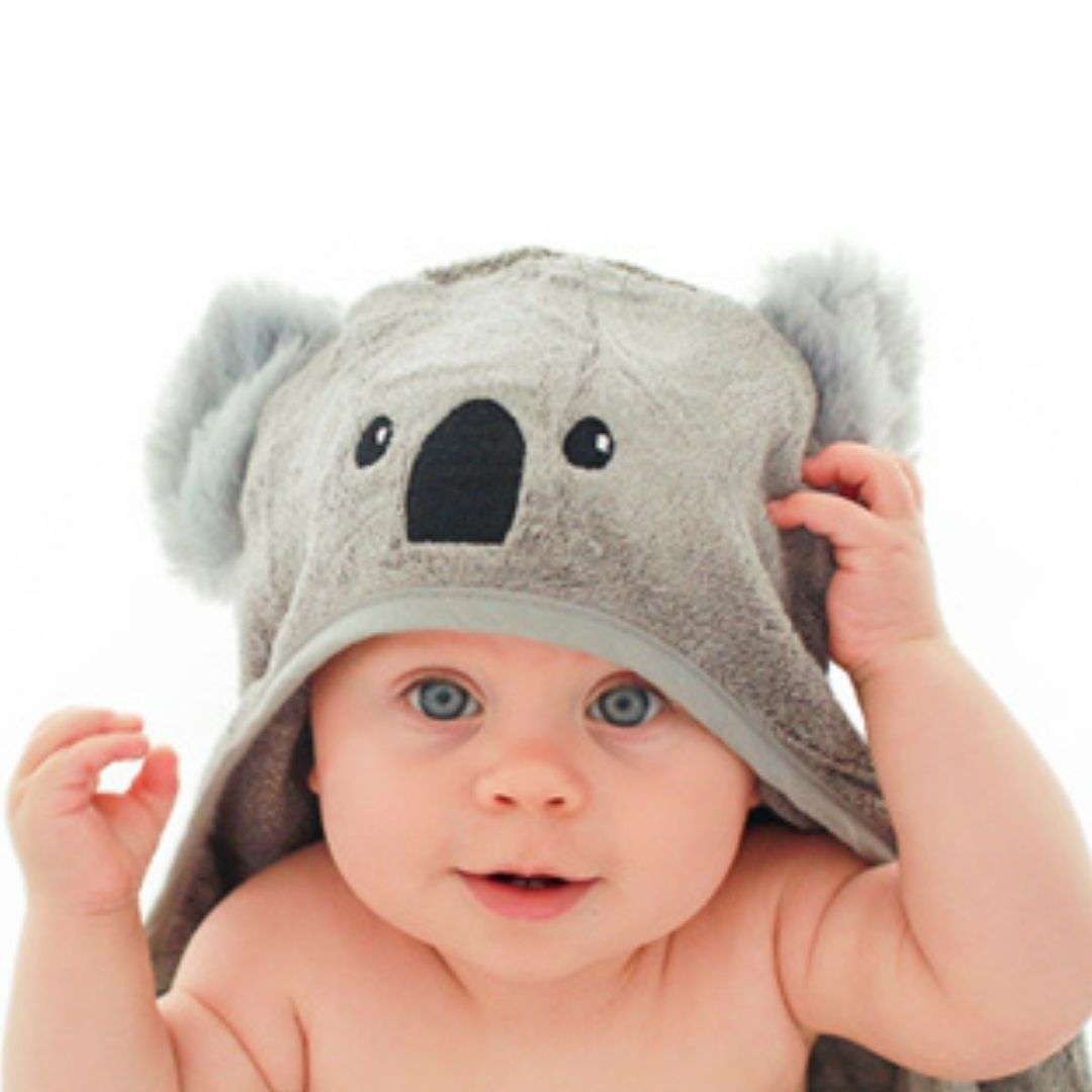 infant child wearing koala hood towel with embroidered eyes and nose and fluffy ears