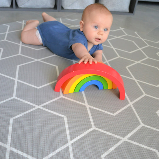 round grey geometric play mat